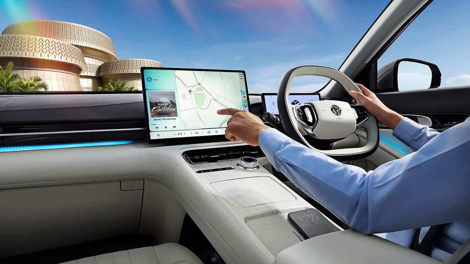 Driver using the 15.4-inch touchscreen in the e.MAS 7 PHEV